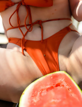 Stunning mom with delicious big-tits seductively eats watermelon outdoors