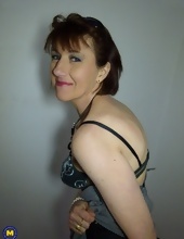 Eccentric mature takes off clothes to show hot body wrapped in lingerie