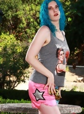 Outdoor solo pics of blue-haired MILF with unshaved pussy