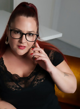 Glasses-wearing BBW chick striking very thoughtful poses